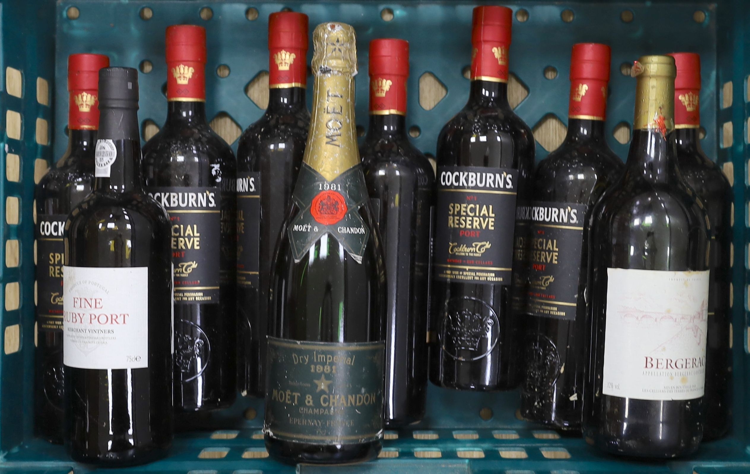 10 bottles: Moet & Chandon, Bergerac, fine ruby port and 7 Cockburns port